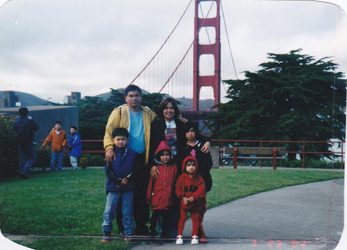 [Janice's family posing in front of Golden Gate Bridge]