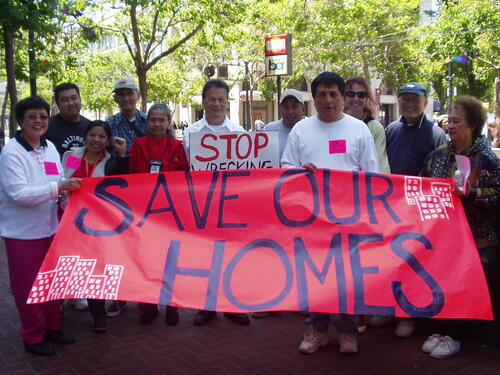 [Members of SOMCAN, Manilatown and Trinity Plaza Association at post-rally in front of Trinity Plaza building]