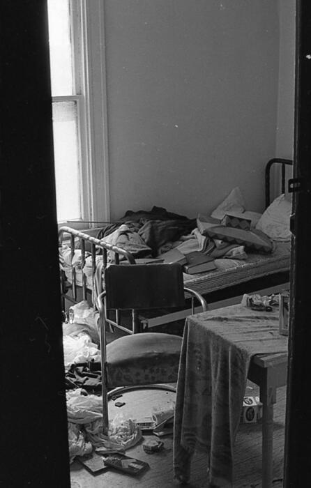 [Daton Hotel, interior of room 204 showing personal belongings and furniture]
