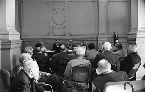 [George Woolf on panel at a meeting of Tenants and Owners in Opposition to Redevelopment (TOOR) at Milner Hotel, 117 4th Street]