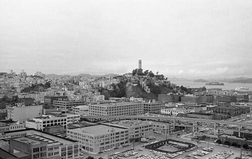 [Telegraph Hill and Coit Tower as seen from a Golden Gateway building, Embarcadero Freeway in foreground]