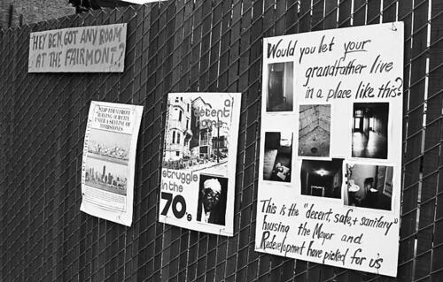 [Posters crafted by Tenants and Owners in Opposition to Redevelopment hang at demolition site, 