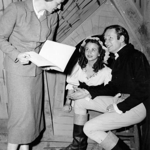 [Mrs. Richard Nason, Francine Moresco and James Richards on the set of the Municipal Theater's production of "A Tale of Two Cities"]