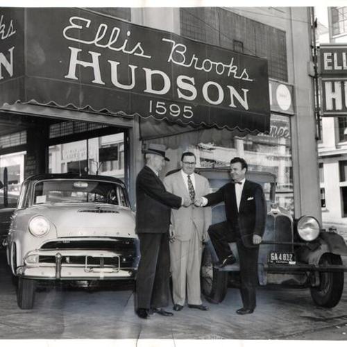 [Floyd Gass buying a car from Ellis Brooks and Hart Shadrick of Ellis Brooks Motors Inc.]