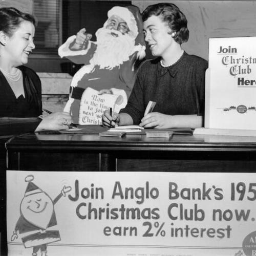 [Mrs. Leo M. Stein signing up for Anglo California National Bank's Christmas Club with bank employee Angie Firpo]