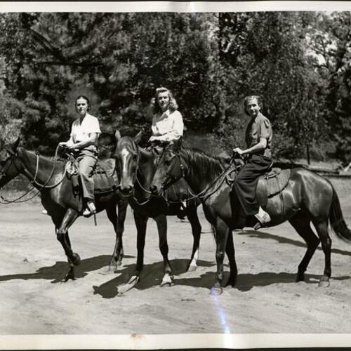 [Three girls on horseback at Camp Mather]