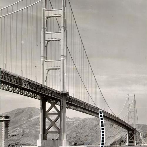 [View of the Golden Gate Bridge, with dotted line showing where two iron workers fell to their deaths in 1953]