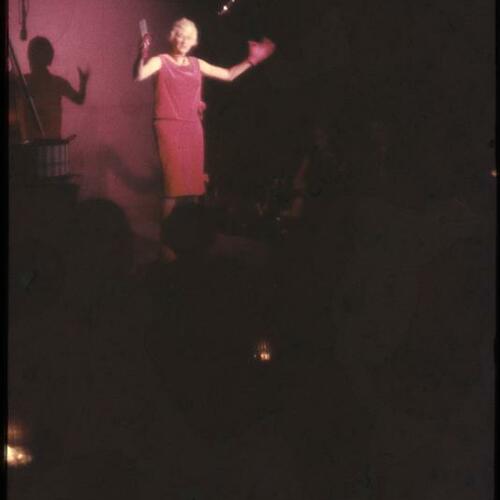 Phyllis Diller performing on stage at the Purple Onion