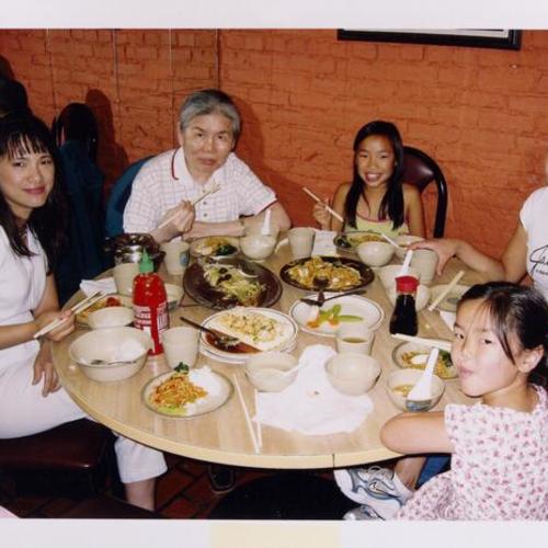 [Mei dining with her family at Silver Restaurant in Chinatown]