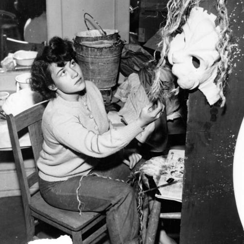[Vesta Ann Hogan working on a costume for Municipal Theater's production of "Androcles and the Lion"]