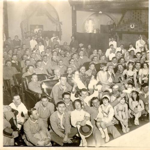 [Audience at the Letterman General Hospital annual Christmas show]