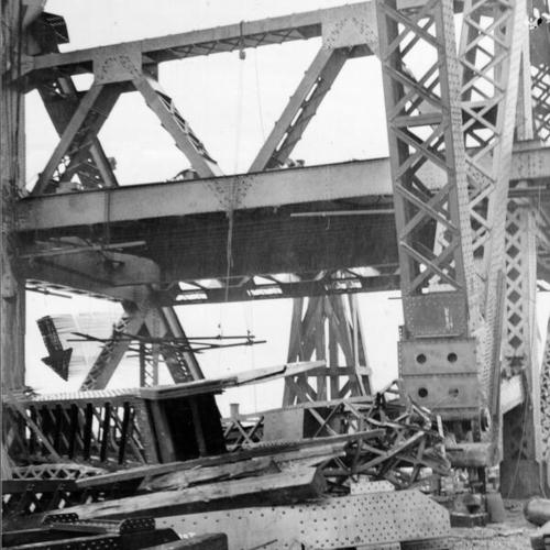 [View of Third street bridge span under construction with arrow pointing to the fallen girder]