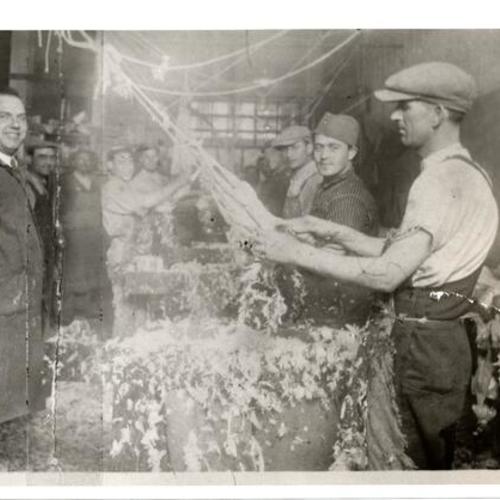 [Men working in a chicken processing plant in Visitacion Valley]