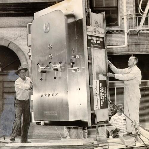[Herman Safe Company workers delivering a vault to the American Trust Company]