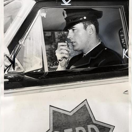 [Officer Warren McCormack in patrol car operating out of Park Station]