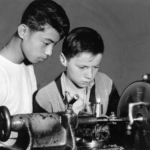 [Students Warren Lee and Ernest Baldry in a machine shop at Francisco Junior High School]