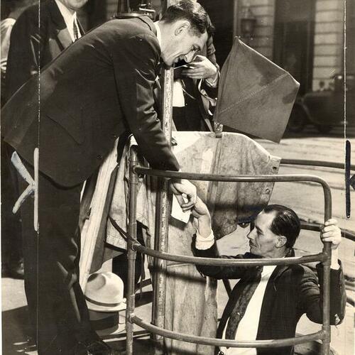 [Frank Green, H.H. Jones and Alvin Carney conducting a subway study at Market street]