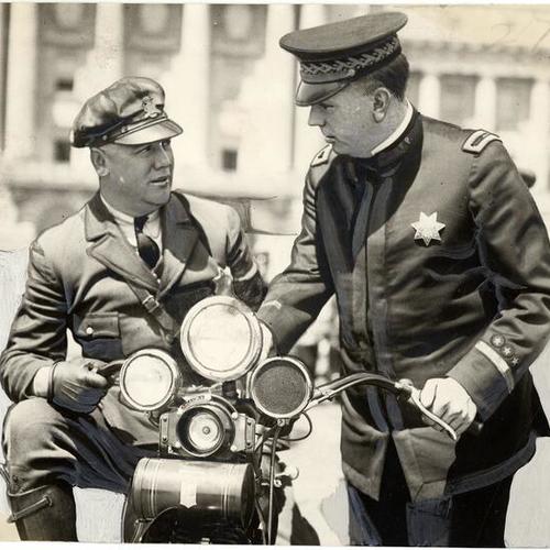 [Police Chief William Quinn (right) with John Wisnon, Jr.]