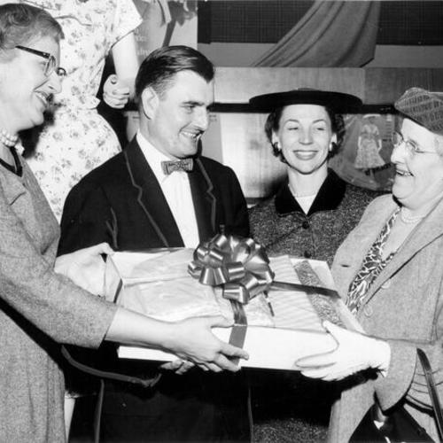 [Mrs. C. H. McDavid, winner of a contest sponsored by Macy's San Francisco, Safeway Stores and Family Circle Magazine, receiving her prize]
