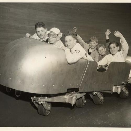[Group of boys on the "Rocket Ride" at Playland at the Beach]