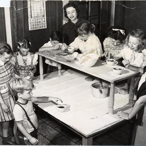 [Children coloring Easter eggs at Edgewood Orphanage]