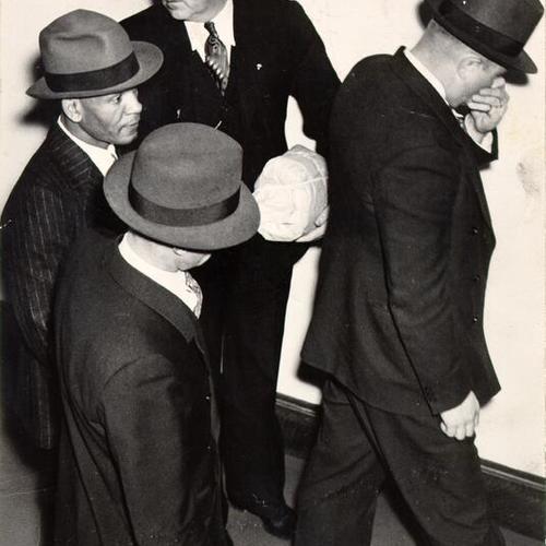 [Convict Frank E. Moten (left), during a trial of two other prisoners who made a failed escape attempt from Alcatraz Prison in May, 1938]