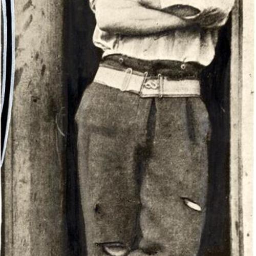 [Unidentified man standing in a doorway in the Barbary Coast district]