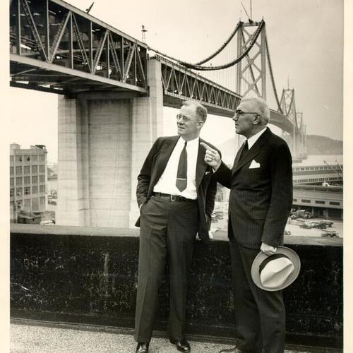 [Colonel Willard Chevalier and Chief Engineer C. H. Purcell on an inspection tour of the San Francisco-Oakland Bay Bridge five months before it opened to the public]