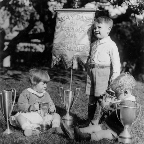 [Three children in Golden Gate Park on May Day in 1927]