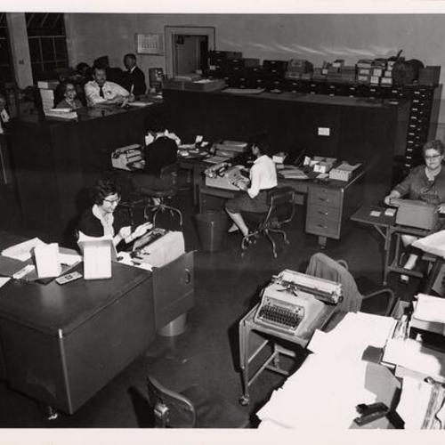 [Employees working in crowded office in Old Hall of Justice]