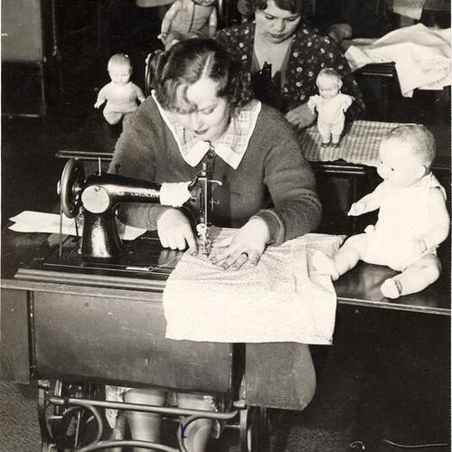 [Women working in a doll factory]