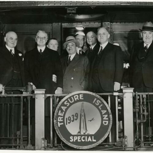 William L. Hughson (center) with Mayor Rossi, Mayor William McCracken, Harris Connick, Sheriff Dan Murphy (left to right) on Treasure Island Special train