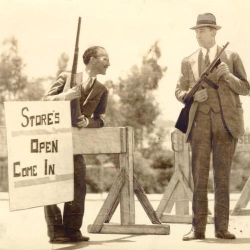 [Armed men standing next to sign during strikes of 1934]