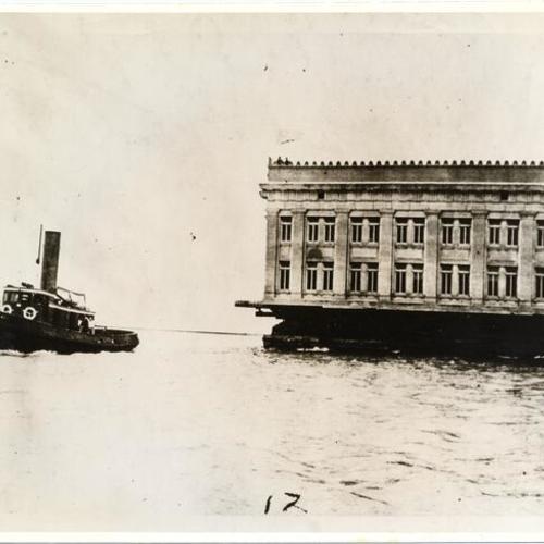 [Ohio State Building being transported by barge from the Marina in San Francisco to Belmont after the close of the Panama-Pacific International Exposition]