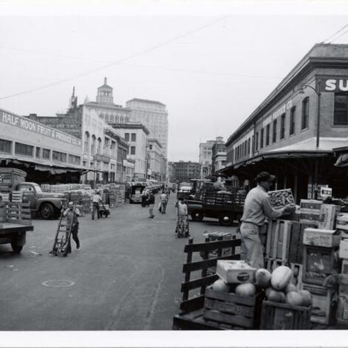[Deliveries being made to produce markets on Washington Street]