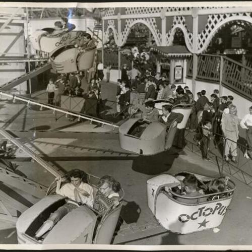 [Kids enjoying a ride on the Octopus at Playland at the Beach]