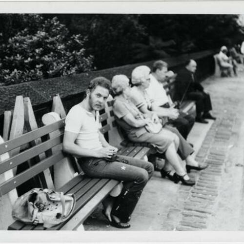 Scott Smith sitting on a bench in a park in New York City