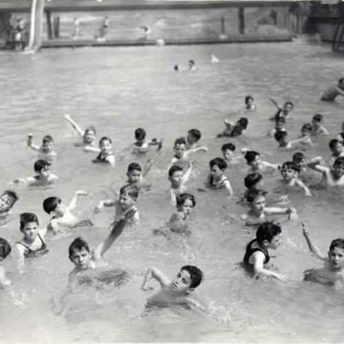 [Kids learning to swim at the Sutro Baths during "Learn To Swim Week"]
