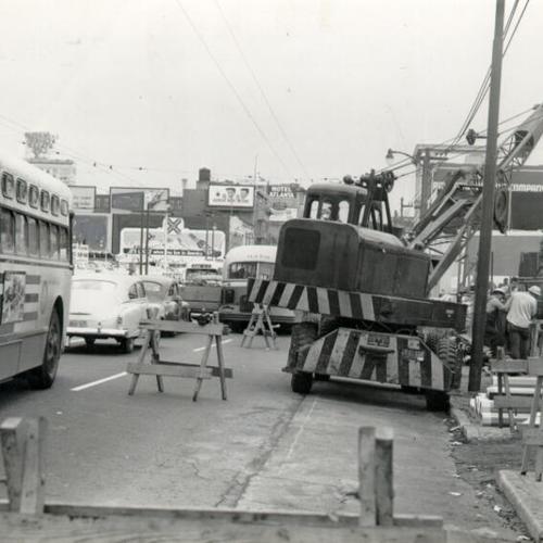 [P.G.& E. workers installing equipment at 8th and Mission streets]