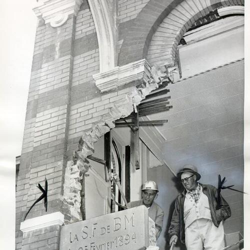 [Cecil Hedrick and Pete Bergren helping to dig out an 1894 cornerstone from the old French Hospital building]