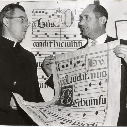[Stanley S. Slotkin and the Reverend William J. Monihan, of the University of San Francisco, holding a page from a 16th century Spanish choir book]