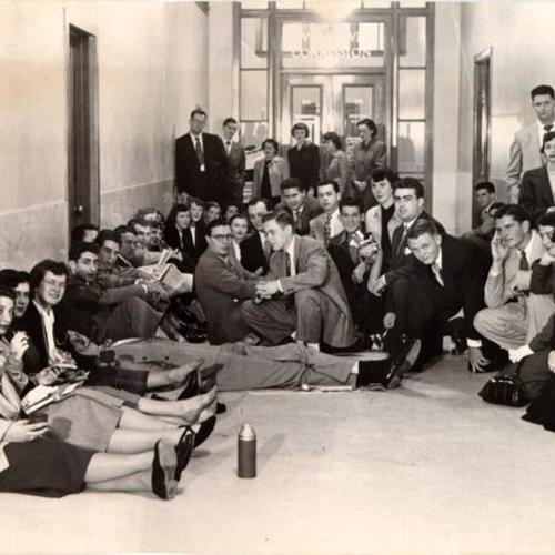 [Group of part-time library employees waiting to take civil service exams at City Hall]