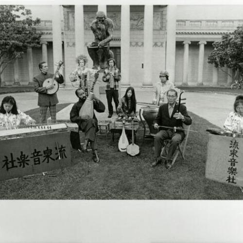 [Portrait of musicians playing various types of instruments in front of the Palace of Legion of Honor]