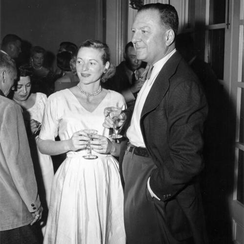 [Lucius Beebe at cocktail party with Mrs. Richard Osborne]