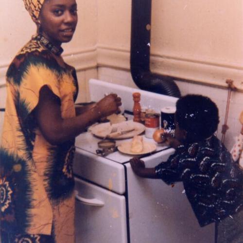 [Faye and son Jabari cooking]