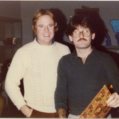 Armistead Maupin (left) and Ken Maley (right) in front of fireplace at the Duck House, 62 Alta Street