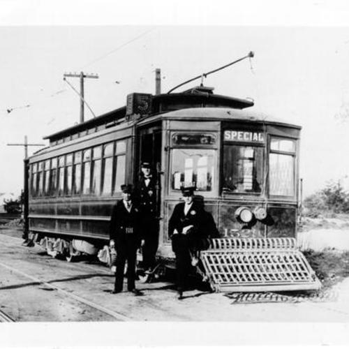 [Three conductors standing beside United Railroad streetcar at 12th Avenue and Fulton Street]