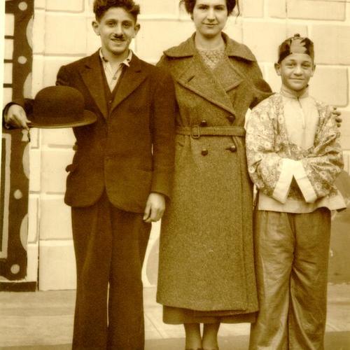 [Woman posing with two costumed youth at Portola Junior High School]