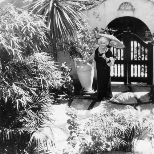 [Annie Laurie poses in her garden]