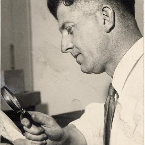 [Police officer Francis X. Latulipe, Jr. looking at a letter.]